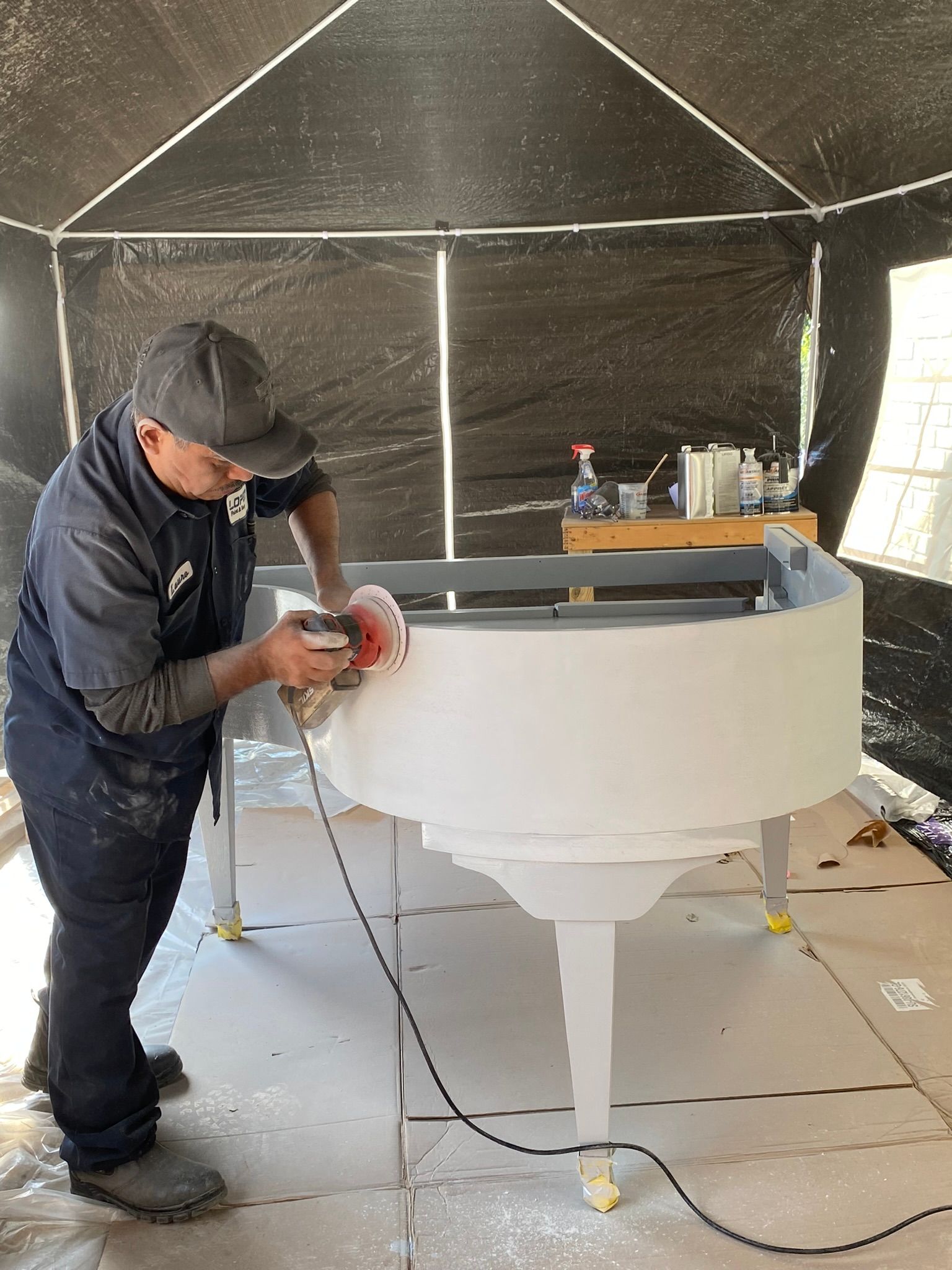 Brother-in-law sanding the first primer coating